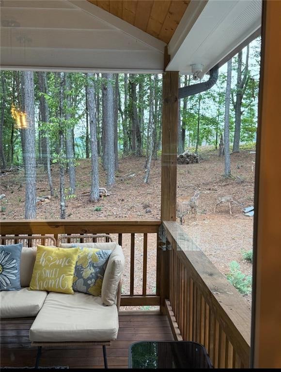 Wooden deck featuring an outdoor living space
