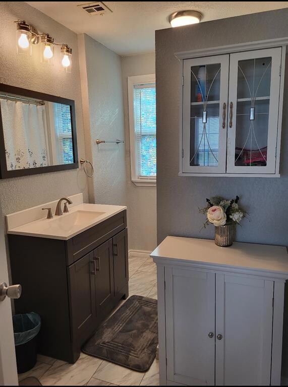 Bathroom with tile floors and oversized vanity