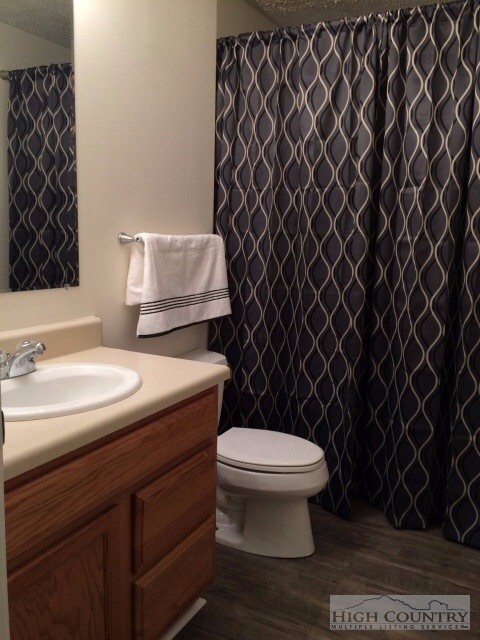1/2 bath on main flr: Laundry area is behind the curtain/ Room for full size side by side units.