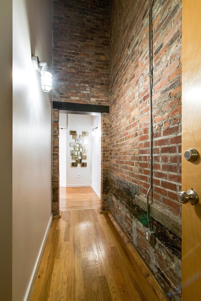All beautiful hardwood floors, with high ceilings & exposed Historic brick walls!!