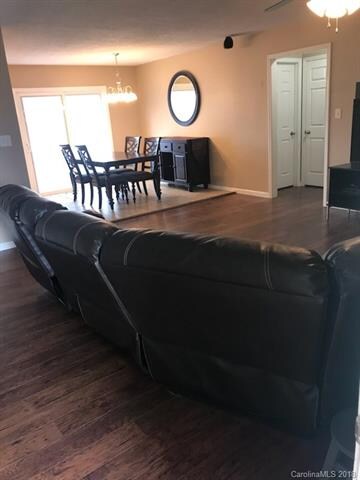 Large family room, with wood floors, large windows
