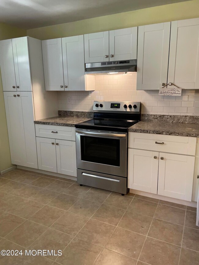 Wall of cabinets with stove
