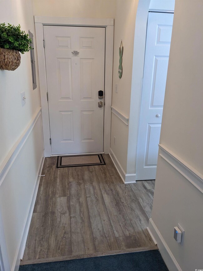 Doorway featuring hardwood / wood-style floors