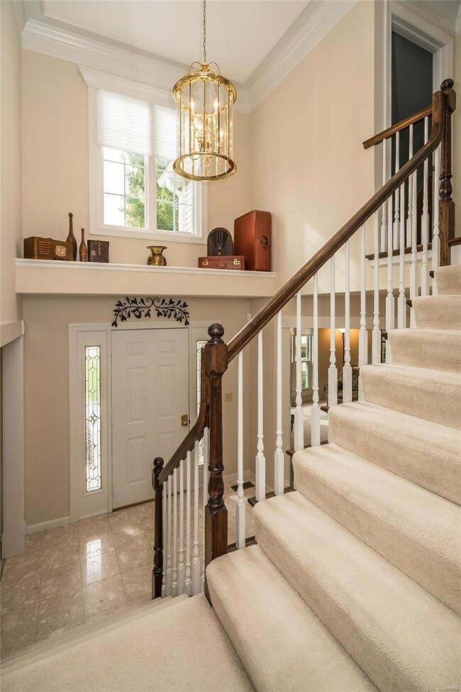 Open & bright two story entry foyer and T staircas
