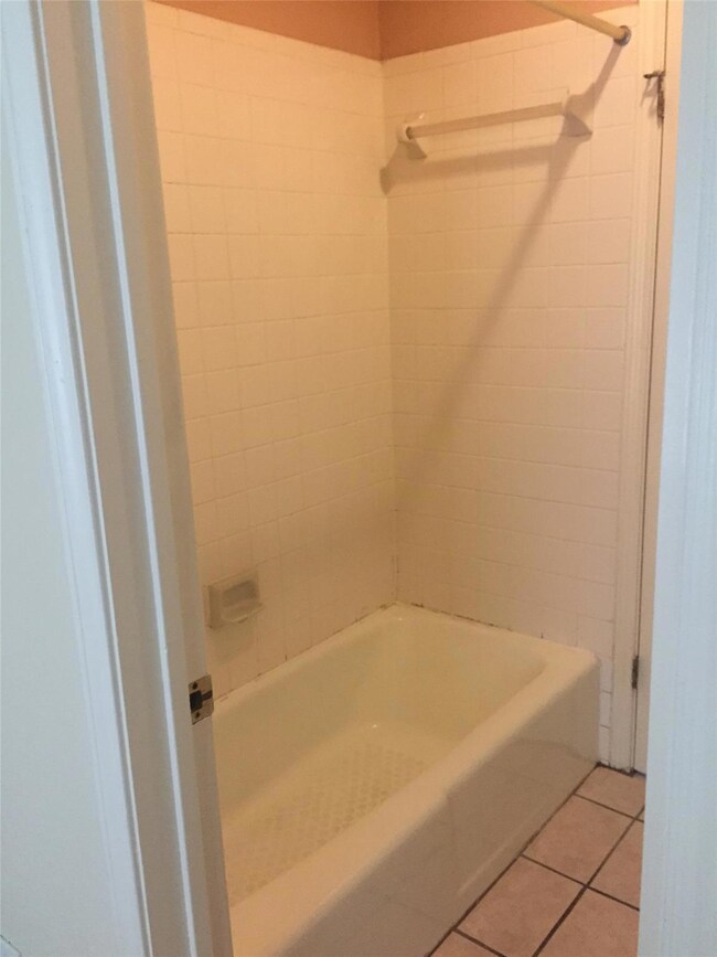 Bathroom with shower / bathing tub combination an