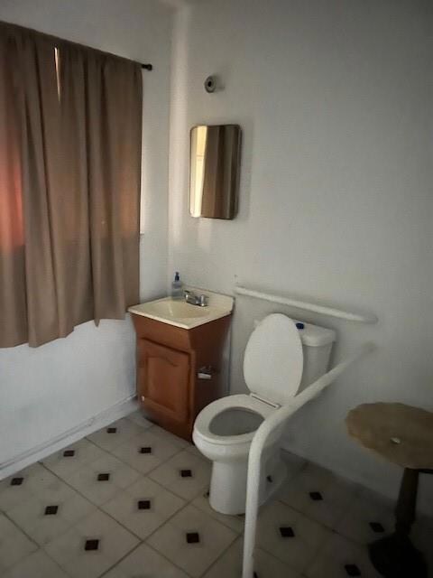 Half bath with vanity and toilet