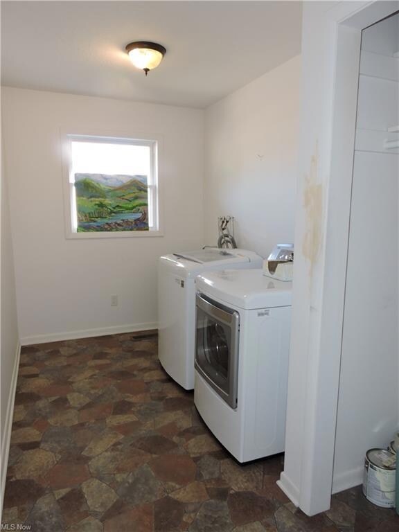 1st floor laundry with utility sink and coat close