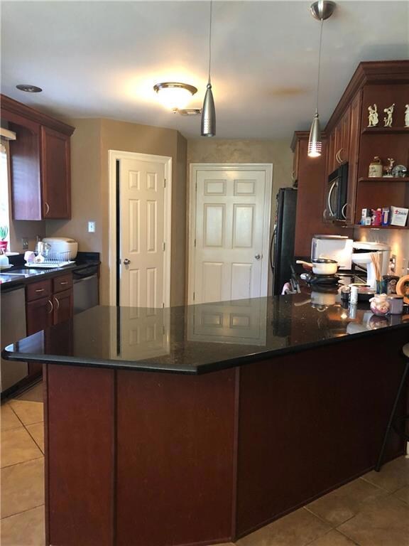 Kitchen has cherrywood cabinets, granite counterto