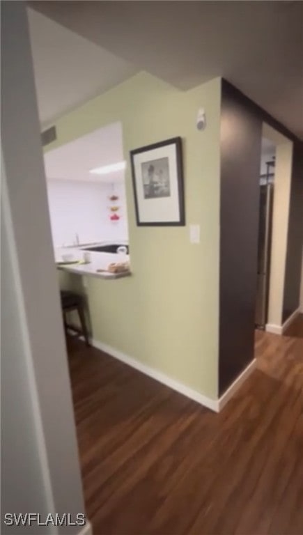 Hallway with wood finished floors