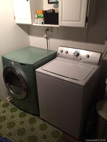 Roomy laundry area with storage...