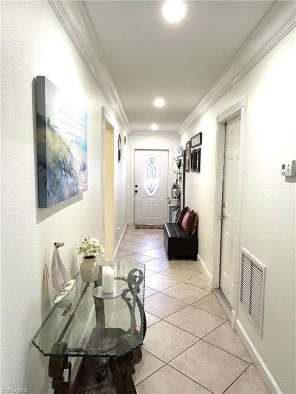 Corridor featuring crown molding, light tile patterned floors, and recessed lighting