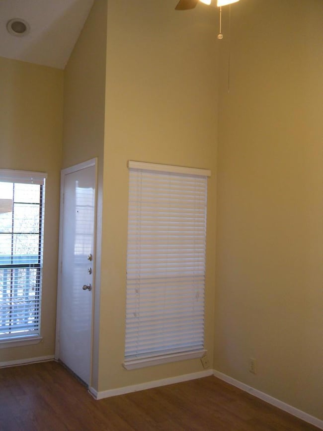 Foyer entrance with lofted ceiling, wood finished