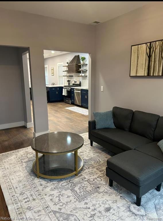 Living area with light wood-type flooring and baseboards