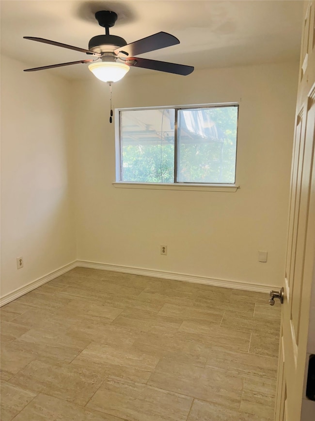 Unfurnished room with light wood-type flooring and a ceiling fan
