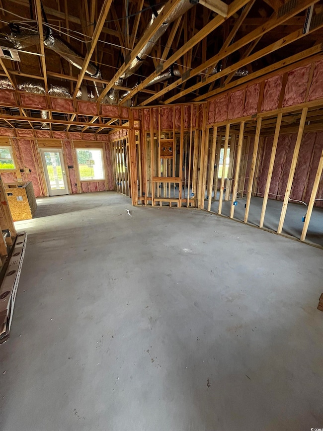 Miscellaneous room with unfinished concrete floors