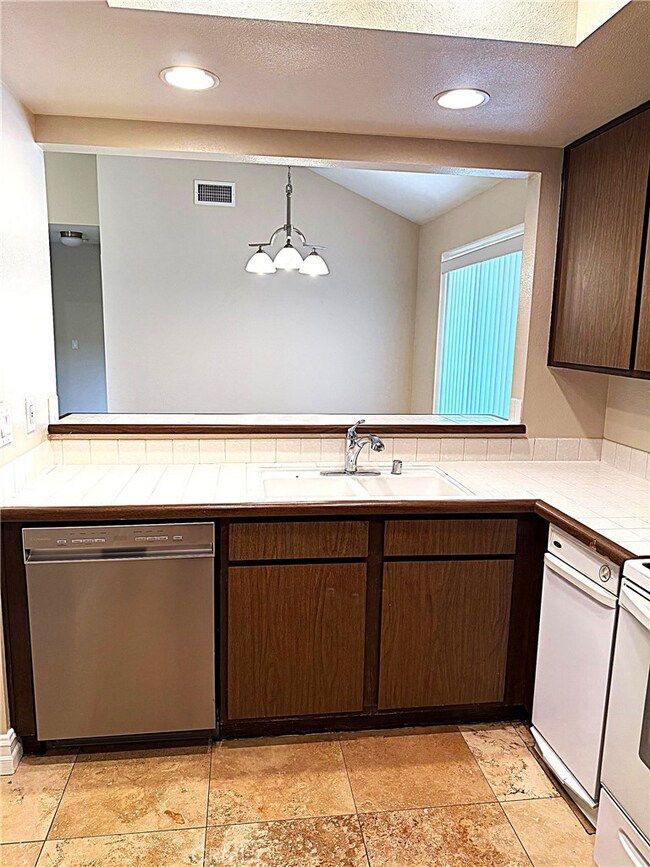 Kitchen with breakfast bar to dining room.
