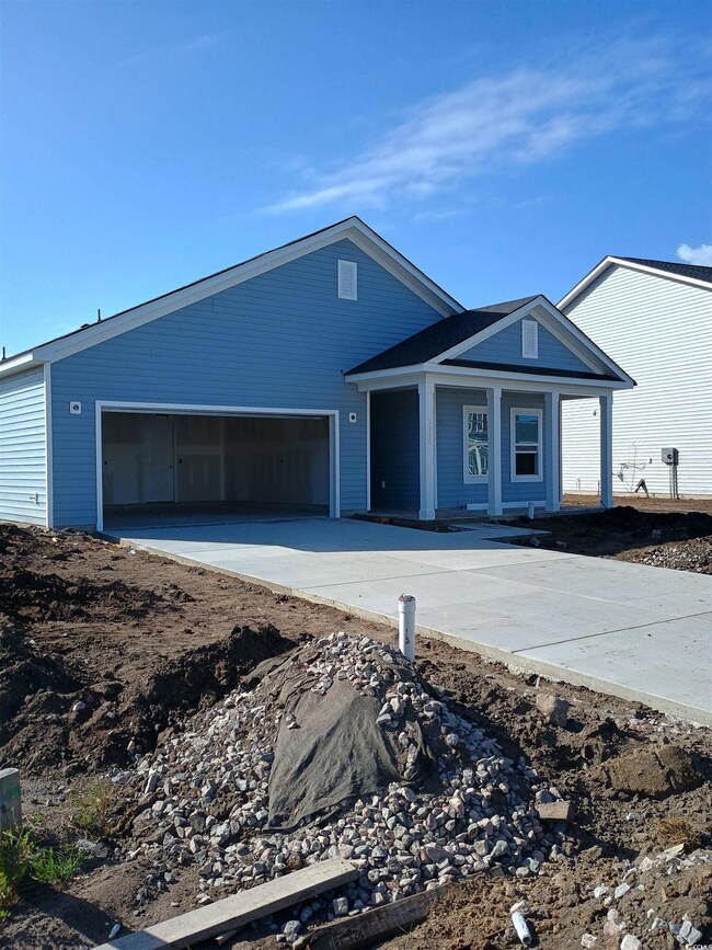 View of front of property featuring a garage