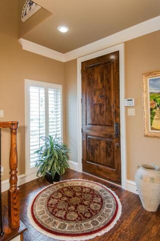 Hand scraped hardwood flooring throughout.