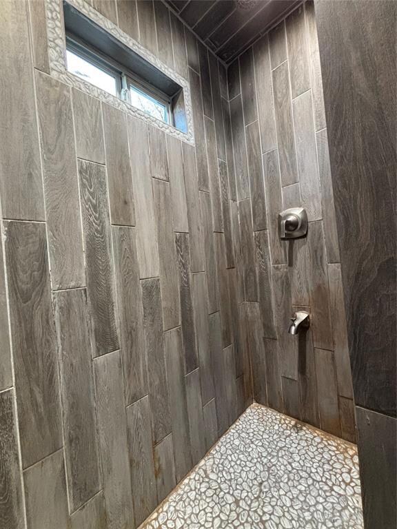 Bathroom with tiled shower