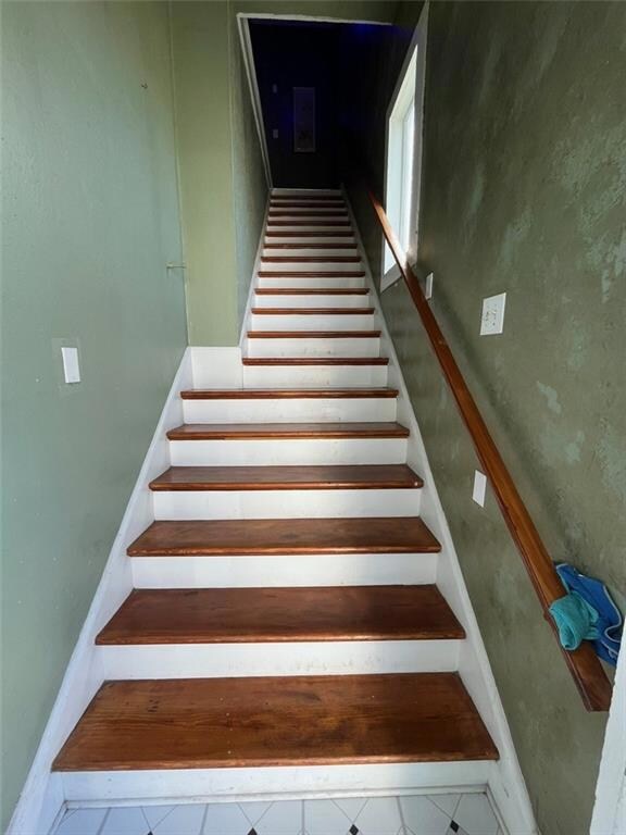Indoor steps leading to upstairs unit