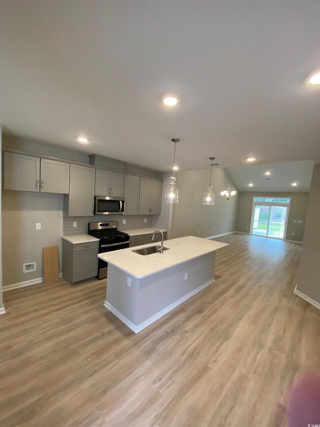 Kitchen with appliances with stainless steel finis