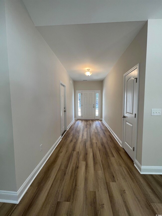 Interior space featuring dark hardwood / wood-styl