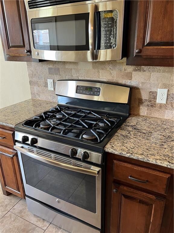 Gas range and stainless microwave