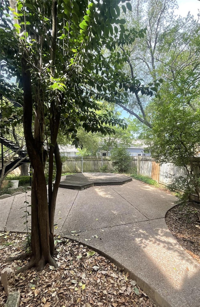 Fenced backyard featuring a patio