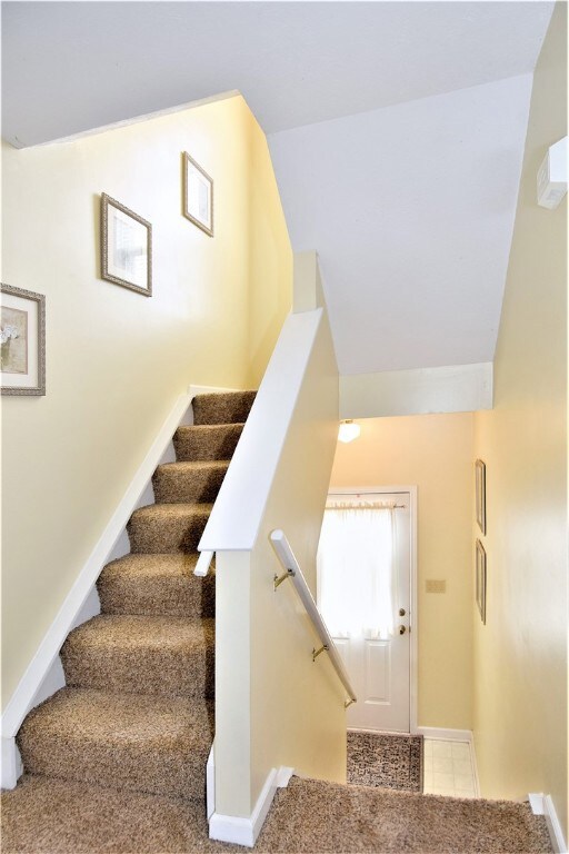 First floor entry with access to stairs.