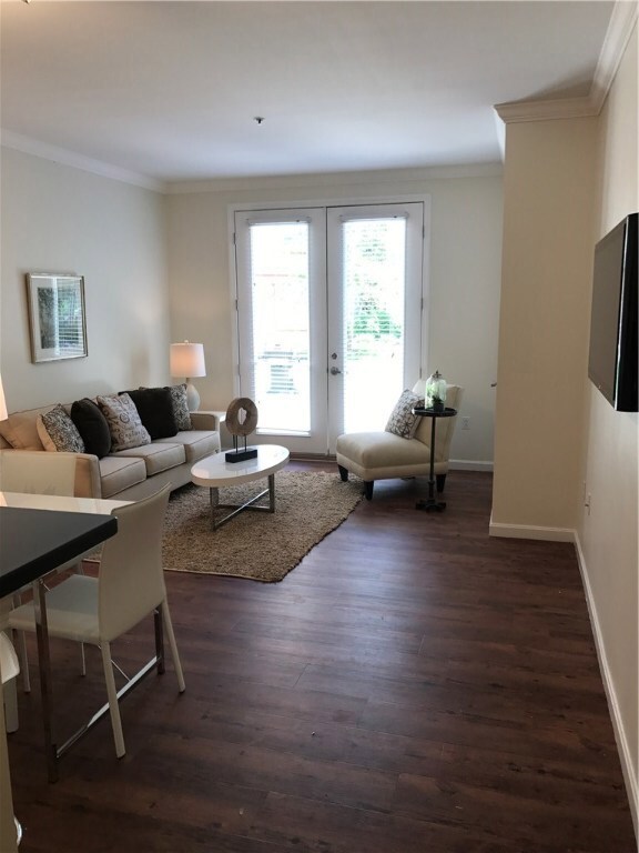 Open Dining and Living room that opens onto a cour