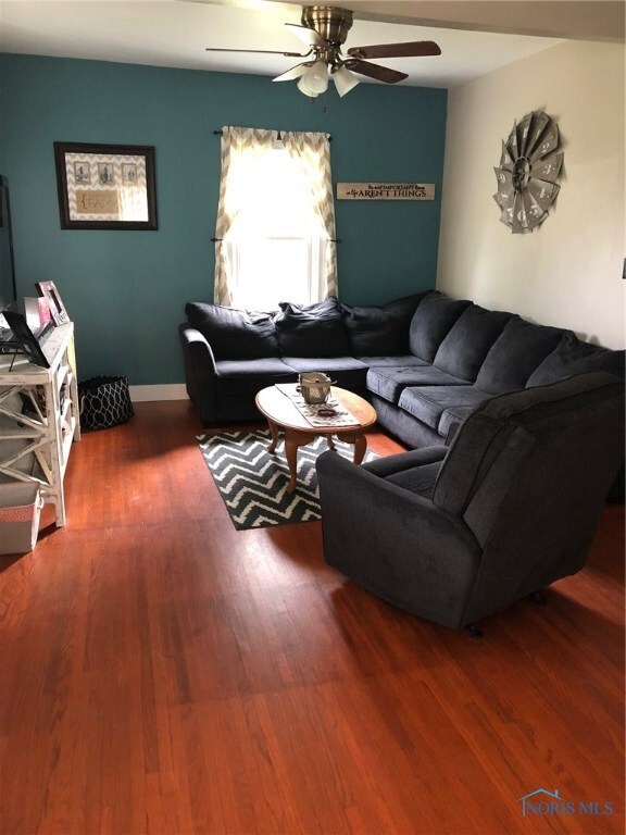Inviting living room with wood floors and ceiling