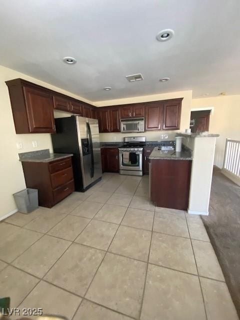 Kitchen with appliances with stainless steel finis