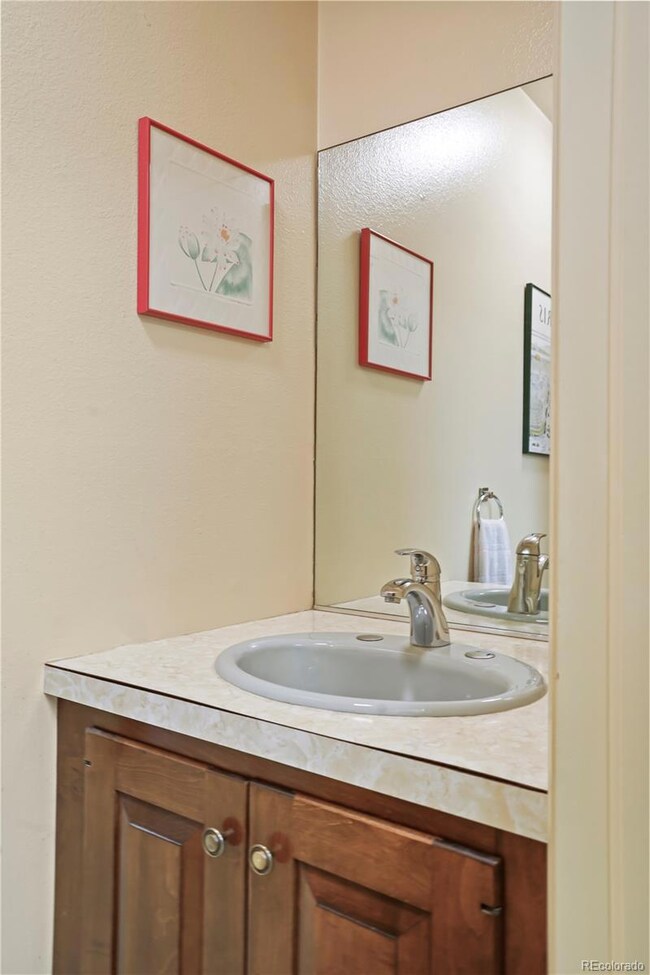 Powder room next to kitchen