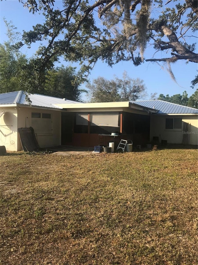 Back view of south side of home showing lanai.