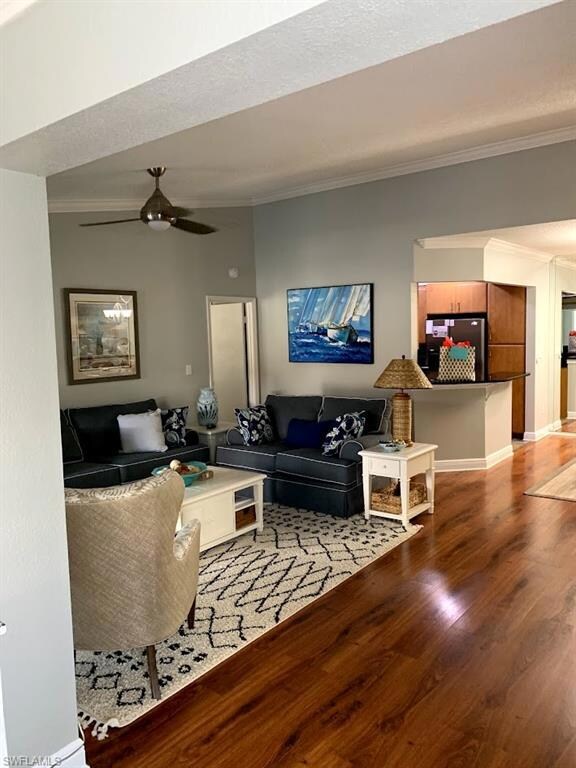 Living room with hardwood / wood-style floors, cei