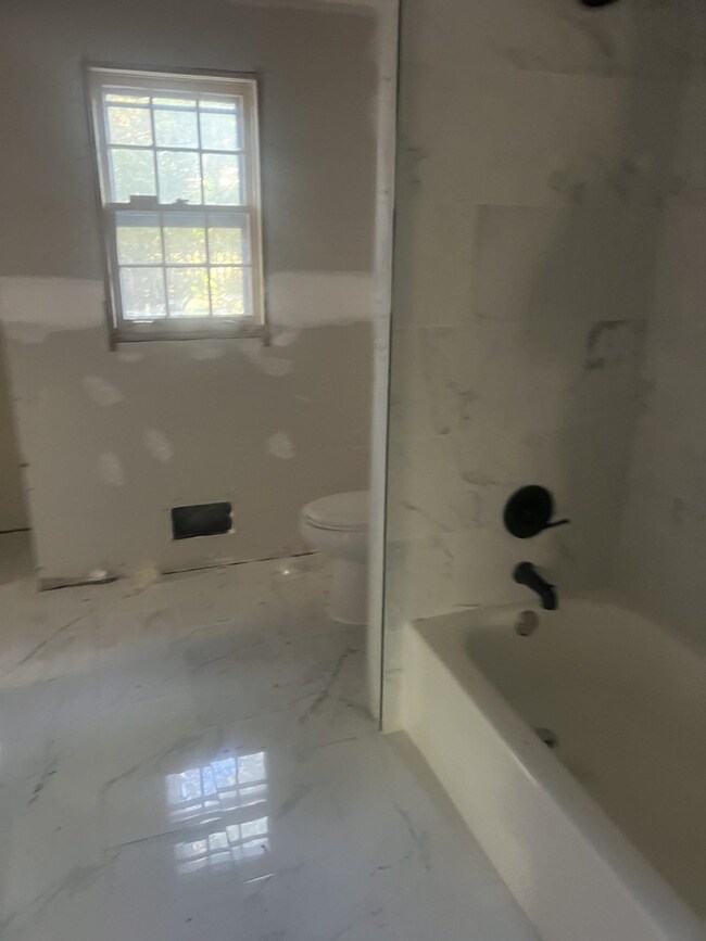 Bathroom with  shower combination and toilet