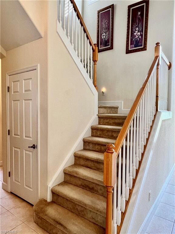 Stairway to second floor with storage under stairs