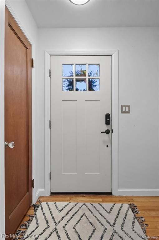 Entryway with wood finished floors