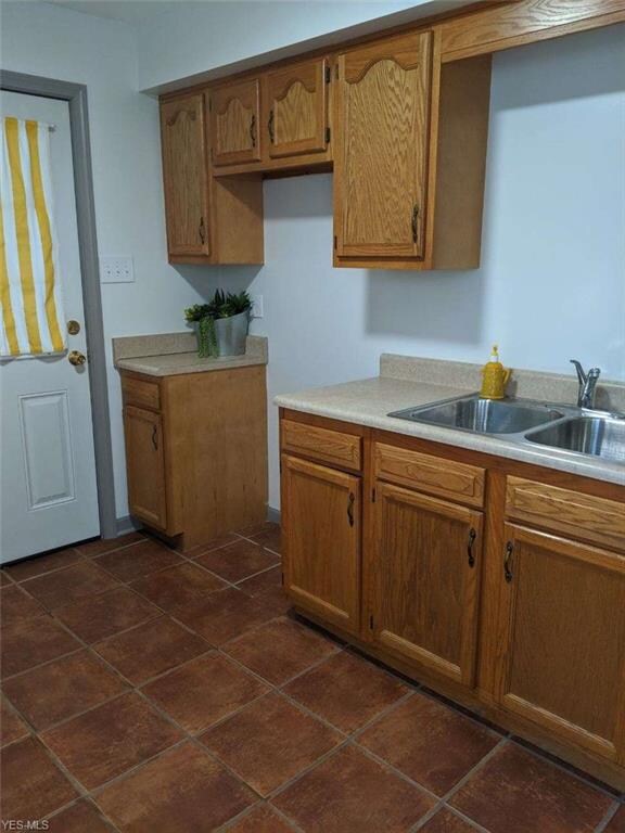 Darling kitchen with ceramic floor, and leads to t