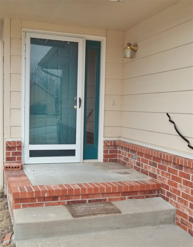 Note the wide sidewalk, handrail, and the covered 