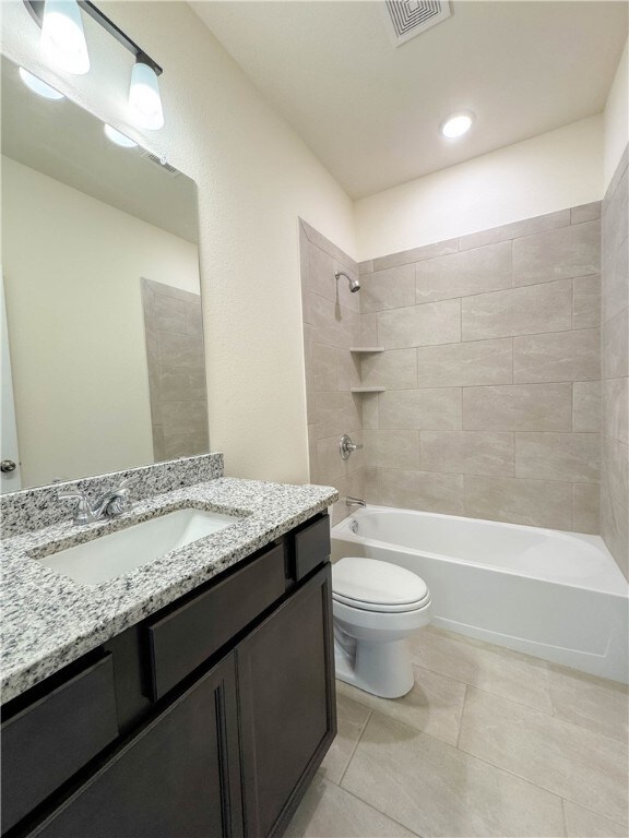 Full bath featuring visible vents, toilet, shower