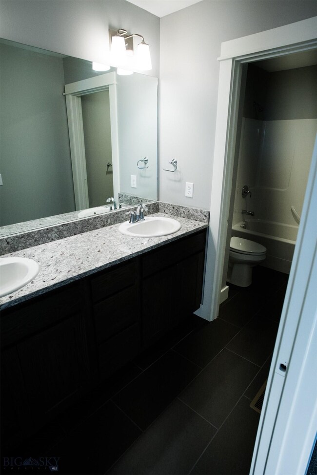 Photos of a similar bathroom. Dual vanity and sepa