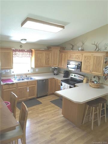 Lots of cabinets and stainless appliances.