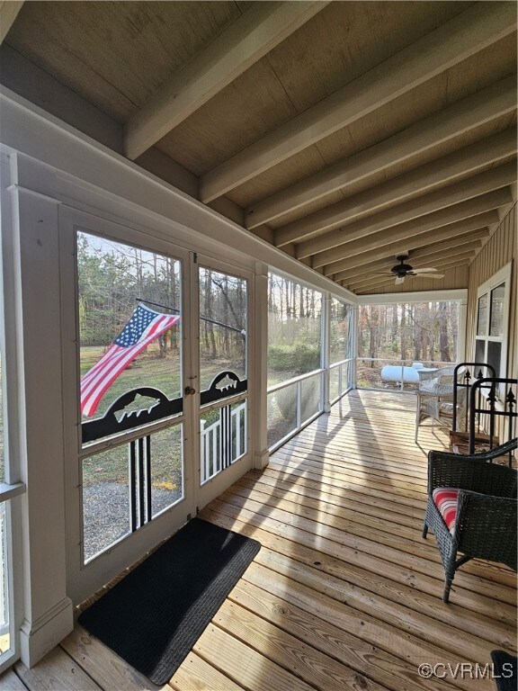 Screened porch featuring beamed ceiling, plenty of