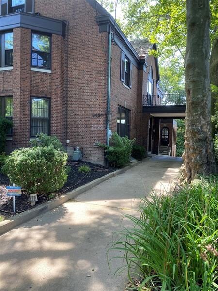 Covered entry way for guests to enter.  Driveway c