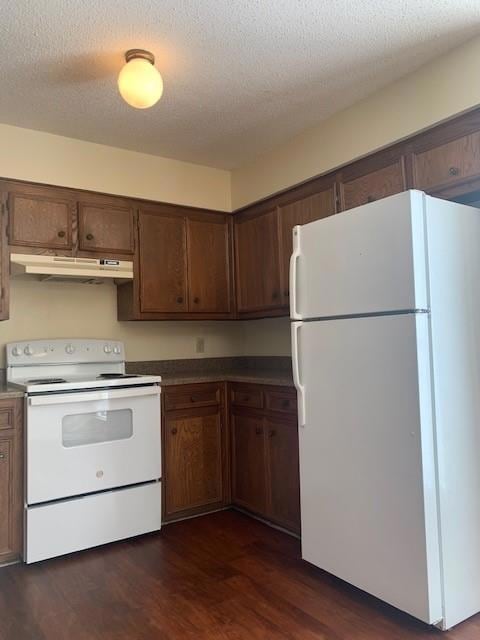 Kitchen featuring white appliances, under cabinet