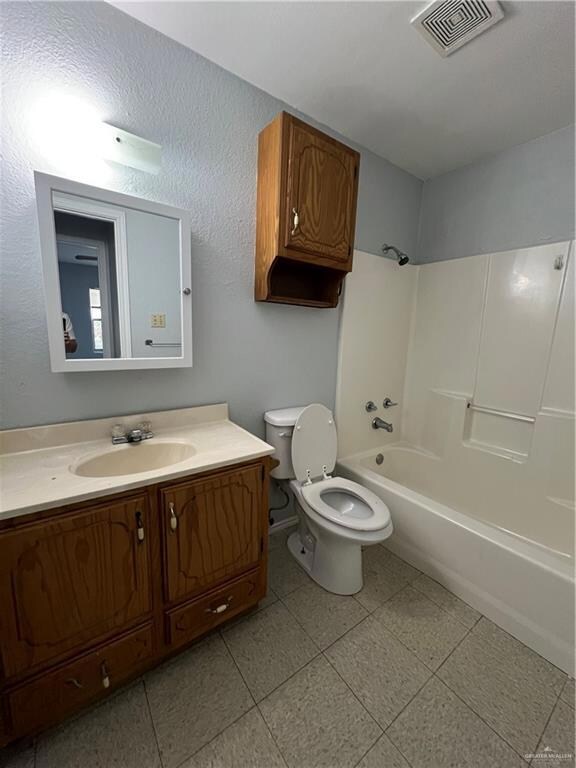 Bathroom featuring vanity and bathing tub / shower combination