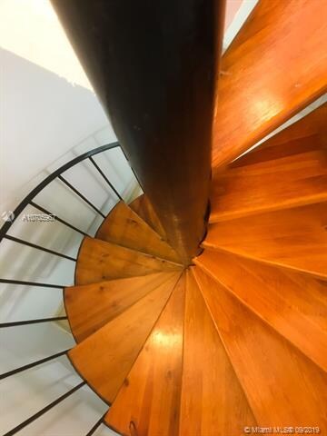 Beautiful Spiraling wood on metal staircase.