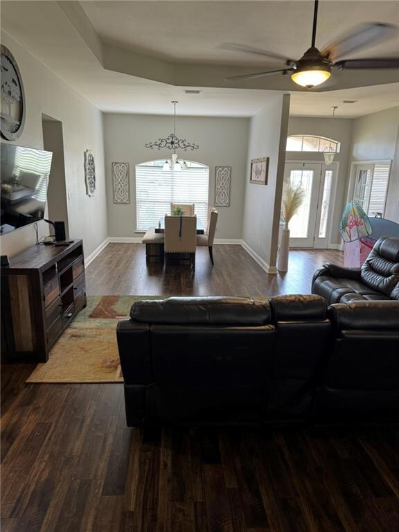 Living area featuring ceiling fan with notable cha