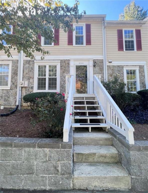 View of front facade featuring stone siding